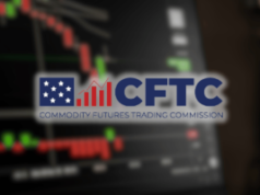 CFTC torna as coisas mais claras para os mercados de previsão, ao retirar a proibição de contratos de eventos A CFTC torna as coisas mais claras para os mercados de previsão, ao retirar a proibição de contratos de eventos. Logotipo CFTC sobreposto em gráficos de negociação desfocados com castiçais vermelhos e verdes, simbolizando mudanças regulatórias que afetam os mercados de previsão e derivativos.