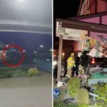 Um círculo vermelho destaca um caminhão no ar, acima de uma rua residencial à noite.