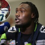 O atacante ofensivo dos Seahawks, Charles Cross, fala com a mídia em 4 de fevereiro de 2026, antes do Super Bowl de domingo.