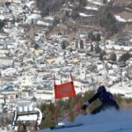 Karli Poliziani, centro-direita, posa para foto com o pai, Len, enquanto a temperatura subia na cidade-sede, durante os Jogos Olímpicos de Inverno de 2026, em Cortina