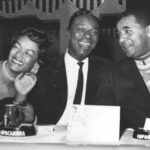 ** ARQUIVO ** Nesta foto de arquivo sem data, Eartha Kitt abraça Nat King Cole, tocando piano no papel de WC Handy, em cena do filme de 1958