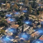 E-mail vazado prova que Ring pretendia usar recurso de vigilância para pessoas e também para cães | Imagem promocional mostrando zonas de vigilância azuis preenchendo um bairro