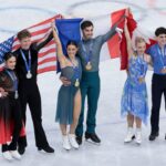 MILAN, ITALY - FEBRUARY 11: From left, Silver medalists Madison Chock and Evan Bates of United States, Gold medalists Laurence Fournier Beaudry and Guillaume Cizeron of France, Bronze medalists Piper Gilles and Paul Poirier of Canada during the victory ceremony of the Figure Skating Ice Dance event on day five of the Milano Cortina 2026 Winter Olympic Games at Milano Ice Skating Arena on February 11, 2026 in Milan, Italy. (Photo by Jean Catuffe/Getty Images)