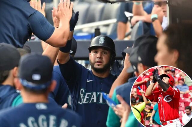 Eugenio Suarez retornando aos Reds com contrato de um ano O terceiro base do Seattle Mariners, Eugenio Suarez, cumprimenta os companheiros de equipe no banco de reservas depois de fazer um home run de duas corridas.