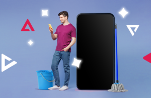 Finalmente estou ‘organizado digitalmente’ e levou apenas uma tarde Uma mão segurando um smartphone mostrando uma lista de aplicativos selecionados para exclusão, com um menu de classificação definido como “Menos usados” e uma lixeira chamada “Desinstalar aplicativos” em segundo plano.