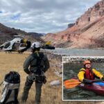Uma equipe de resgate e um helicóptero na margem do Rio Colorado, no Parque Nacional do Grand Canyon.