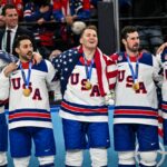 Team USA celebrate winning the gold medal during the Ice Hockey Men's Gold Medal Game match between Canada and USA on day sixteen of the Milano Cortina 2026 Winter Olympic games at Milano Santagiulia Ice Hockey Arena on February 22, 2026 in Milan, Italy.