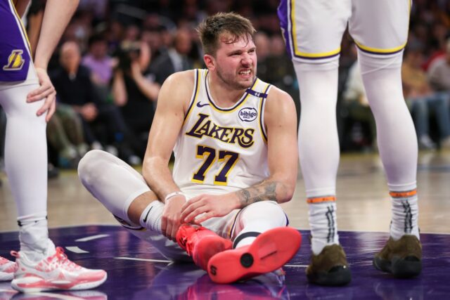LOS ANGELES, CALIFORNIA - MARCH 16: Luka Doncic #77 of the Los Angeles Lakers reacts after getting hurt in the second half against the Phoenix Suns at Crypto.com Arena on March 16, 2025 in Los Angeles, California. NOTE TO USER: User expressly acknowledges and agrees that, by downloading and or using this Photograph, user is consenting to the terms and conditions of the Getty Images License Agreement. (Photo by Meg Oliphant/Getty Images)