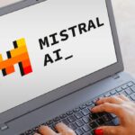 The Mistral AI logo is seen displayed on a laptop screen.
