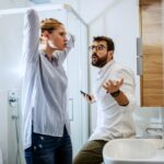 Couple arguing in bathroom