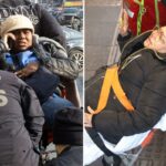 Paramédicos transportando uma mulher para o hospital depois que ela foi empurrada para os trilhos do metrô.