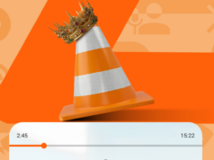 O aplicativo da velha escola que ainda é melhor do que qualquer serviço de streaming moderno Mascote Android verde espiando por trás de um grande cone de trânsito VLC laranja em um fundo estampado.