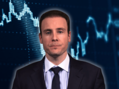 O curioso caso de Michael Selig e suas previsões sobre os mercados O curioso caso de Michael Selig e as suas previsões sobre os mercados. O presidente da CFTC, Mike Selig, de terno escuro e gravata, enfrenta a câmera contra um fundo azul com gráficos financeiros estilizados e gráficos de dados de mercado.