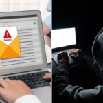 Uma figura encapuzada digitando em um laptop com uma tela branca brilhante em um quarto escuro.