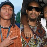 DJ Young Slade fazendo sinal de paz em evento.