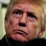 Donald Trump gaggles with reporters while aboard Air Force One on February 6, 2026 en route to Palm Beach, Florida.