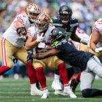 SAN JOSE, CALIFÓRNIA - 04 DE FEVEREIRO: Nick Emmanwori nº 3 do Seattle Seahawks fala à mídia antes do Super Bowl LX no San Jose Convention Center em 04 de fevereiro de 2026 em San Jose, Califórnia. (Foto de Eakin Howard/Getty Images)