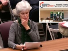 Oficial do Trump DOJ investigando por que um capítulo do Turning Point USA foi relatado aos serviços de proteção à criança Uma mulher com cabelos curtos e grisalhos e um lenço verde falando em uma reunião do conselho escolar de Maryland.