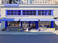 Polymarket abre a ‘primeira mercearia gratuita’ de Nova York A mercearia Polymarket localizada em uma rua de Nova York. Janelas e bandeira azuis. Mercearias do lado de fora e muito mais podem ser vistas dentro das janelas.