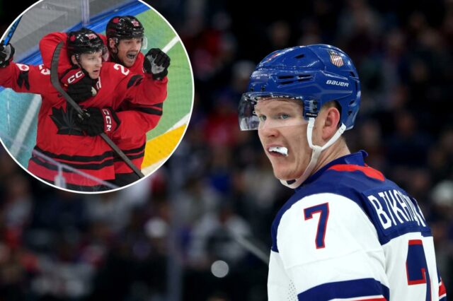 O canadense Nathan MacKinnon (29) comemora com Sam Reinhart (13) depois que MacKinnon marcou um gol contra a Finlândia durante o terceiro período de uma semifinal de hóquei no gelo masculino nos Jogos Olímpicos de Inverno de 2026 em Milão, Itália, sexta-feira, 20 de fevereiro de 2026. (AP Photo/Carolyn Kaster)