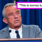 Uma pessoa de terno e gravata está falando em um ambiente interno, possivelmente entregando notícias ou fazendo uma declaração