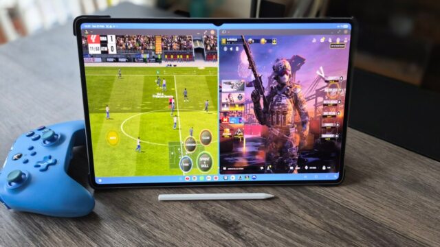 The Samsung Galaxy Tab S11 Ultra in a living room setting with a blue controller next to it