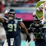 Byron Murphy II comemorando uma recuperação complicada com seu companheiro de equipe Devon Witherspoon no Super Bowl 60.