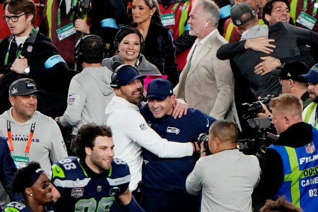 SANTA CLARA, CALIFORNIA - FEBRUARY 08: Head coach Mike MacDonald of the Seattle Seahawks is hugged by offensive coordinator Klint Kubiak after a 29-13 win against the the New England Patriots in Super Bowl LX at Levi's Stadium on February 08, 2026 in Santa Clara, California. (Photo by Thearon W. Henderson/Getty Images)