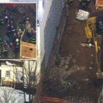 Bombeiros e socorristas atendem ao desabamento de uma trincheira em um canteiro de obras.