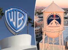 Warner Bros avalia reabertura de negociações de venda com a Paramount: relatórios O logotipo da Warner Bros em um prédio com palmeiras e um céu azul claro ao fundo.