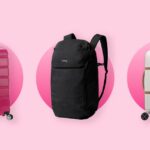 Uma mulher bonita e feliz está andando pelas ruas de Barcelona e aproveitando um belo dia de outono na cidade grande.