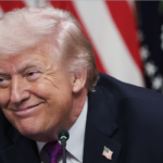 President Donald Trump listens to speakers during a roundtable meeting on the administration's