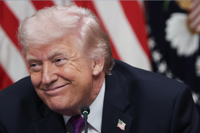 President Donald Trump listens to speakers during a roundtable meeting on the administration's 