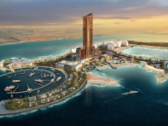 A construção é retomada no projeto do resort Wynn Al Marjan Island, nos Emirados Árabes Unidos, em meio às tensões no Irã A construção do projeto de resort Wynn Al Marjan Island, nos Emirados Árabes Unidos, é retomada em meio às tensões no Irã. Renderização aérea do resort Wynn Al Marjan Island em Ras Al Khaimah, mostrando uma alta torre de hotel de bronze cercada por praias, piscinas e uma marina circular com iates nas águas azul-turquesa do Golfo ao pôr do sol.