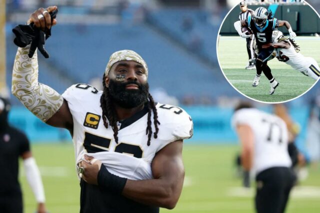 O linebacker do New Orleans Saints, Demario Davis (56), acena para os fãs nas arquibancadas enquanto sai do campo após um jogo entre o Tennessee Titans e o New Orleans Saints, em 28 de dezembro de 2025, no Nissan Stadium em Nashville, Tennessee.
