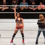 Nikki Bella in WWE ring with Alexa Bliss during live show in Germany