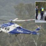 A polícia bloqueia uma estrada em Porepunkah, no estado de Victoria, Austrália, em 28 de agosto de 2025.