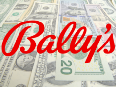 A receita do quarto trimestre da Bally aumenta à medida que a expansão dos cassinos e os jogos online impulsionam o crescimento O crescimento da Bally no segundo trimestre de 2025 alimenta a ousada transformação 'Bally's 2.0'. Bally's Q4 2025. Logotipo da Red Bally sobre fundo de dólares.