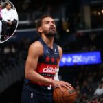 Trae Young, do Washington Wizards, olha para cima, preparando-se para um lance livre.