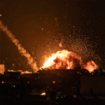A fireball lights the sky following a missile strike on Tel Aviv on February 28, 2026.