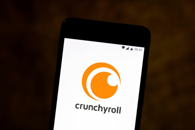 In this photo illustration a Crunchyroll logo seen displayed