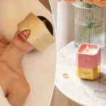 Expositor de perfume Guerlain com elementos decorativos dourados.