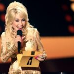 Co-host Dolly Parton speaks onstage at the Academy of Country Music Awards held at Allegiant Stadium on March 7, 2022 in Las Vegas, Nevada. (Photo by Chris Polk/Variety/Penske Media via Getty Images)