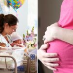 Uma mãe sorrindo enquanto segura seu bebê recém-nascido em uma cama de hospital.