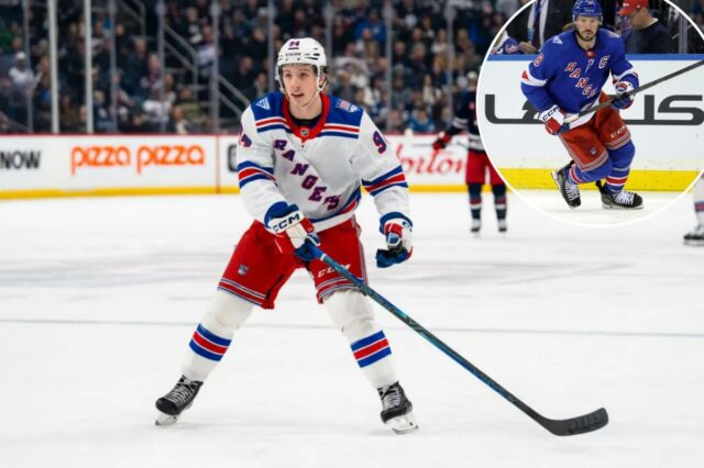 Gabe Perreault, do New York Rangers, patinando durante um jogo de hóquei.
