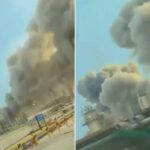 Uma imagem mostra um grande incêndio nas instalações da gigante petrolífera saudita Aramco em Ras Tanura, com uma espessa fumaça subindo para o céu.