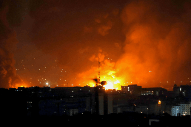 Smoke and fire rise from the site of airstrikes at Mehrabad International Airport in Tehran on March 7, 2026.