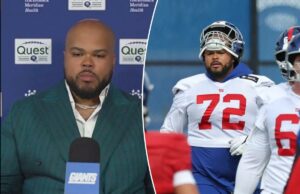 Jermaine Eluemunor, do Giants, vestido para o sucesso na assinatura do contrato de carreira Jermaine Eluemunor usa um terno elegante enquanto fala para a mídia.