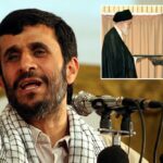 Mahmoud Ahmadinejad falando em um pódio com um microfone.