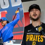 O Infielder do New York Mets, Francisco Lindor, se aquece com um taco durante um treino.